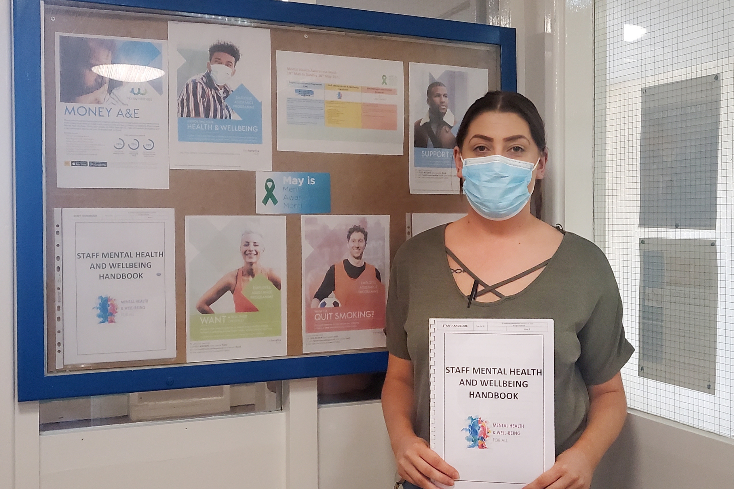 Joanne Kerr, activities coordinator at Appleby Care Home (managed by HCMS) with the Staff Mental Health and Wellbeing handbook.